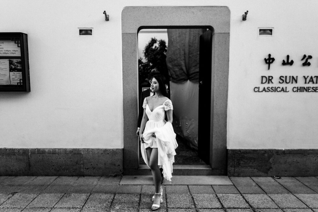 Sachin Khona's black and white photography of a bride outside a building